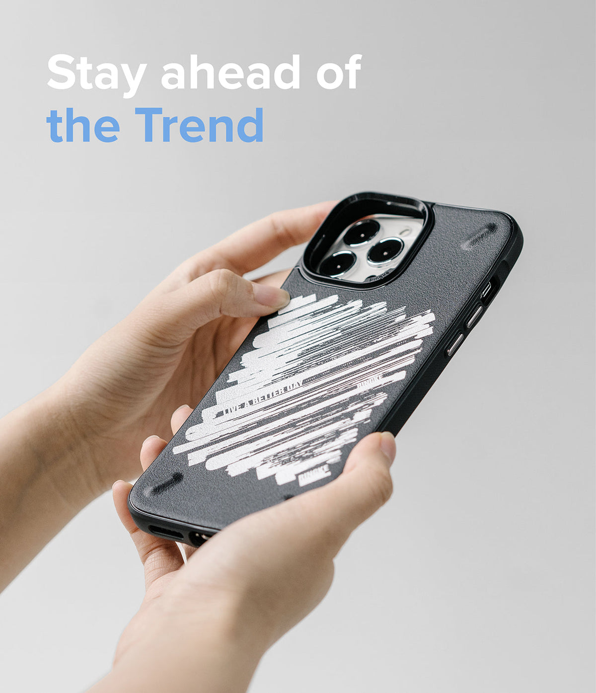 iPhone 13 Pro Max Case | Onyx Design - Hands holding a black phone case with a white brushstroke design and text.