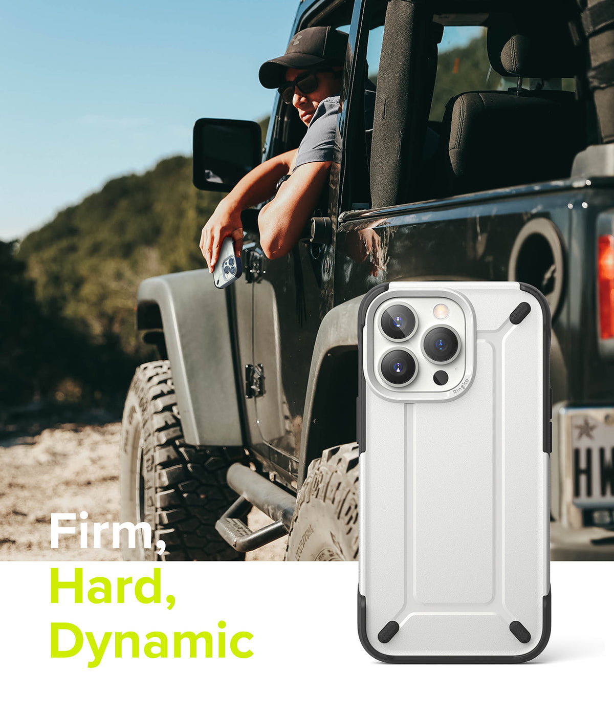 iPhone 13 Pro Case | DX - A rugged white and black phone case displayed against a man in a Jeep on a dirt road.