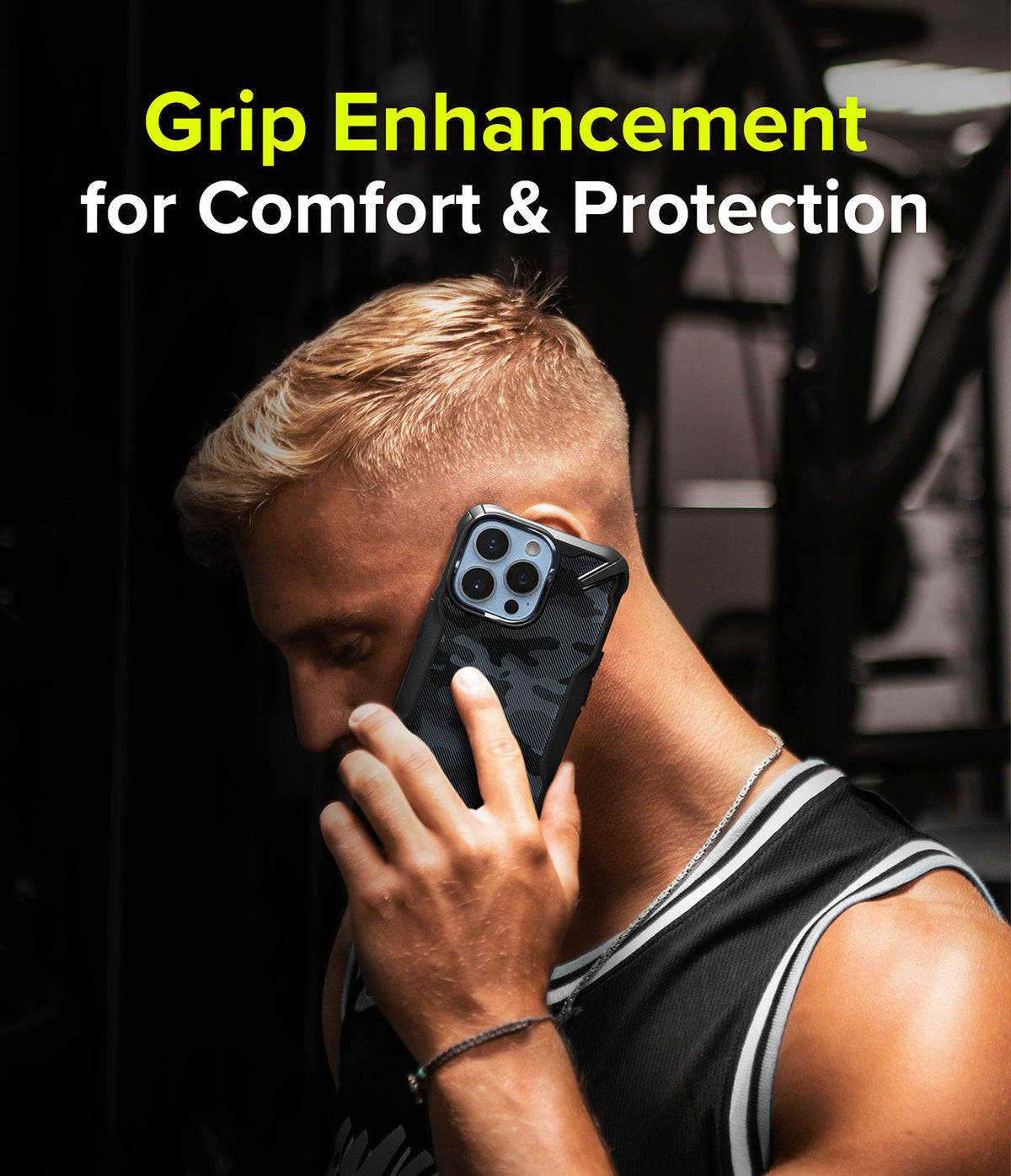 iPhone 13 Pro Case | Fusion-X - Man in a gym talking on an iPhone 13 Pro with a black camo Fusion-X protective case.