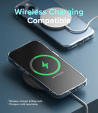 iPhone 13 Case | Fusion - Clear phone case on an iPhone 13 charging wirelessly with a MagSafe charger and charging icon.