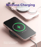 iPhone 13 Mini Case | Fusion - Clear phone case on a wireless charger showing a green charging icon on the screen.