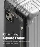 iPhone 14 Plus Case | Fusion Bumper - A black square-frame phone case resting against a metallic silver suitcase.