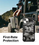 iPhone 14 Plus Case | Fusion-X - Black camo phone case with rugged bumper edges shown against a man in a Jeep.