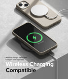 iPhone 14 Plus Case | Silicone - Two beige silicone iPhone cases, one charging with a MagSafe puck and one on a wireless pad.