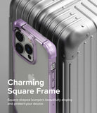 iPhone 14 Pro Max Case | Fusion Bumper - Purple square-frame bumper case on an iPhone 14 Pro Max next to a silver suitcase.