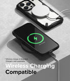 iPhone 14 Pro Max Case | Fusion-X - Two iPhones in black Fusion-X cases charging wirelessly on a gray surface.