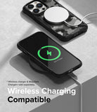 iPhone 14 Pro Max Case | Fusion-X - Two phones in black protective cases charging wirelessly on a gray surface.