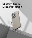 iPhone 14 Pro Max Case | Silicone - Beige silicone phone case hovering above a concrete ledge with debris, text above.