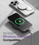 iPhone 14 Pro Case | Fusion Matte - iPhone 14 Pro in a clear case charging wirelessly with a MagSafe puck and charging pad.