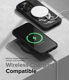 iPhone 14 Pro Max Case | Onyx Design - Black phone case with graffiti art charging wirelessly via MagSafe.