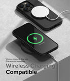 iPhone 14 Pro Case | Onyx - Two black iPhone 14 Pro phones in Onyx cases charging wirelessly on a textured gray surface.