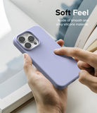 iPhone 14 Pro Case | Silicone - Hand holding a lavender silicone phone case with text overlay about its soft feel.