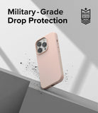 iPhone 14 Pro Case | Silicone - Pink silicone iPhone 14 Pro case floating above a geometric surface with debris.