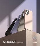 iPhone 14 Case | Silicone - Three iPhone 14 silicone cases in black, blue, and beige standing on a textured pedestal.