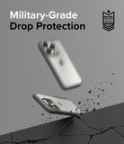 iPhone 15 Pro Max Case | Fusion Bold - Two iPhones in protective cases bouncing off a cracked surface with military-grade text.