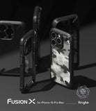 iPhone 15 Pro Max Case | Fusion-X - Multiple black Fusion-X phone cases with camo back panels arranged on a dark surface.