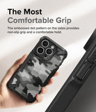 iPhone 15 Pro Max Case | Fusion-X - Hand holding a camo-patterned phone case with textured, non-slip sides for grip.