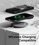 iPhone 15 Pro Max Case | Fusion-X - iPhone 15 Pro Max in a black case wirelessly charging on a pad with a green charging icon.