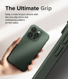 iPhone 15 Pro Max Case | Onyx - Hand holding a green phone case with a textured micro-dot grip pattern on the side.
