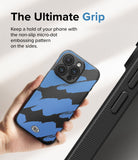 iPhone 15 Pro Max Case | Onyx Design - Hand holding a blue and black brushstroke patterned phone case with micro-dot side grip.
