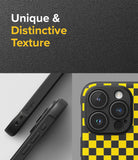 iPhone 15 Pro Max Case | Onyx Design - Close-up of a black and yellow checkered phone case with a textured finish.