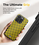 iPhone 15 Pro Max Case | Onyx Design - Hand holding a yellow and black checkered phone case with micro-dot side grip.