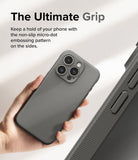 iPhone 15 Pro Max Case | Onyx - Hand holding a grey phone case with a textured micro-dot side grip pattern.