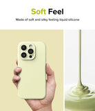 iPhone 15 Pro Max Case | Silicone Magnetic - Hand holding a pale yellow silicone phone case next to liquid silicone.