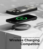iPhone 15 Plus Case | Fusion Bold - iPhone 15 Plus in a black case wirelessly charging on a circular pad with a green charging icon on screen.