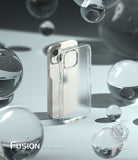 iPhone 15 Plus Case | Fusion - Clear phone case standing in front of an iPhone 15 Plus surrounded by floating glass spheres.