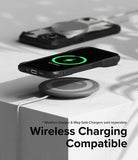 iPhone 15 Plus Case | Fusion-X - iPhone 15 Plus in a black Fusion-X case wirelessly charging on a pad with a green charging icon.