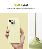 iPhone 15 Plus Case | Silicone Magnetic - Hand holding a pale yellow silicone phone case next to liquid silicone pouring.