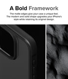 iPhone 15 Pro Case | Fusion Bold - Close-up of a matte black phone case edge next to a textured, dark sand-like surface.
