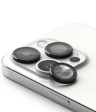 iPhone 15 Pro | Camera Lens Frame Glass - Protective black glass covers applied to the triple camera lenses of a white iPhone.