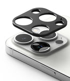 iPhone 15 Pro Max / 15 Pro | Camera Styling - Black protective lens cover hovering above the iPhone 15 Pro camera array.