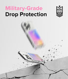iPhone 15 Pro Case | Fusion Card - Clear phone case with card slot hitting a cracked surface with debris flying.