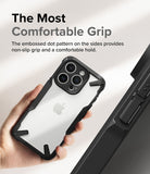 iPhone 15 Pro Case | Fusion-X - Hand holding a phone in a black protective case with a textured, non-slip dot pattern on the side.