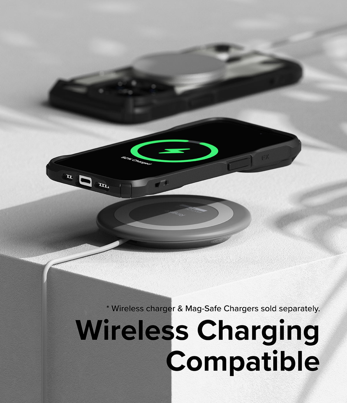 iPhone 15 Pro Case | Fusion-X Magnetic Matte Black - Matte black phone case on a wireless charging pad showing 92% charge.
