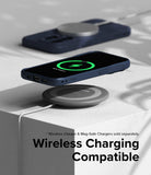 iPhone 15 Pro Case | Onyx - Navy phone case on a wireless charging pad showing a green charging icon on the screen.