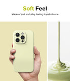iPhone 15 Pro Case | Silicone Magnetic - Hand holding a pale yellow silicone phone case next to liquid silicone pouring.