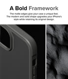 iPhone 15 Case | Fusion Bold - Close-up of a matte black phone case edge next to a textured, dark sand-like surface.