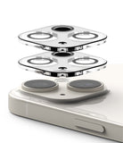 iPhone 15 Plus / 15 | Camera Protector Glass [2 Pack] - Two transparent glass camera covers hovering above phone lenses.