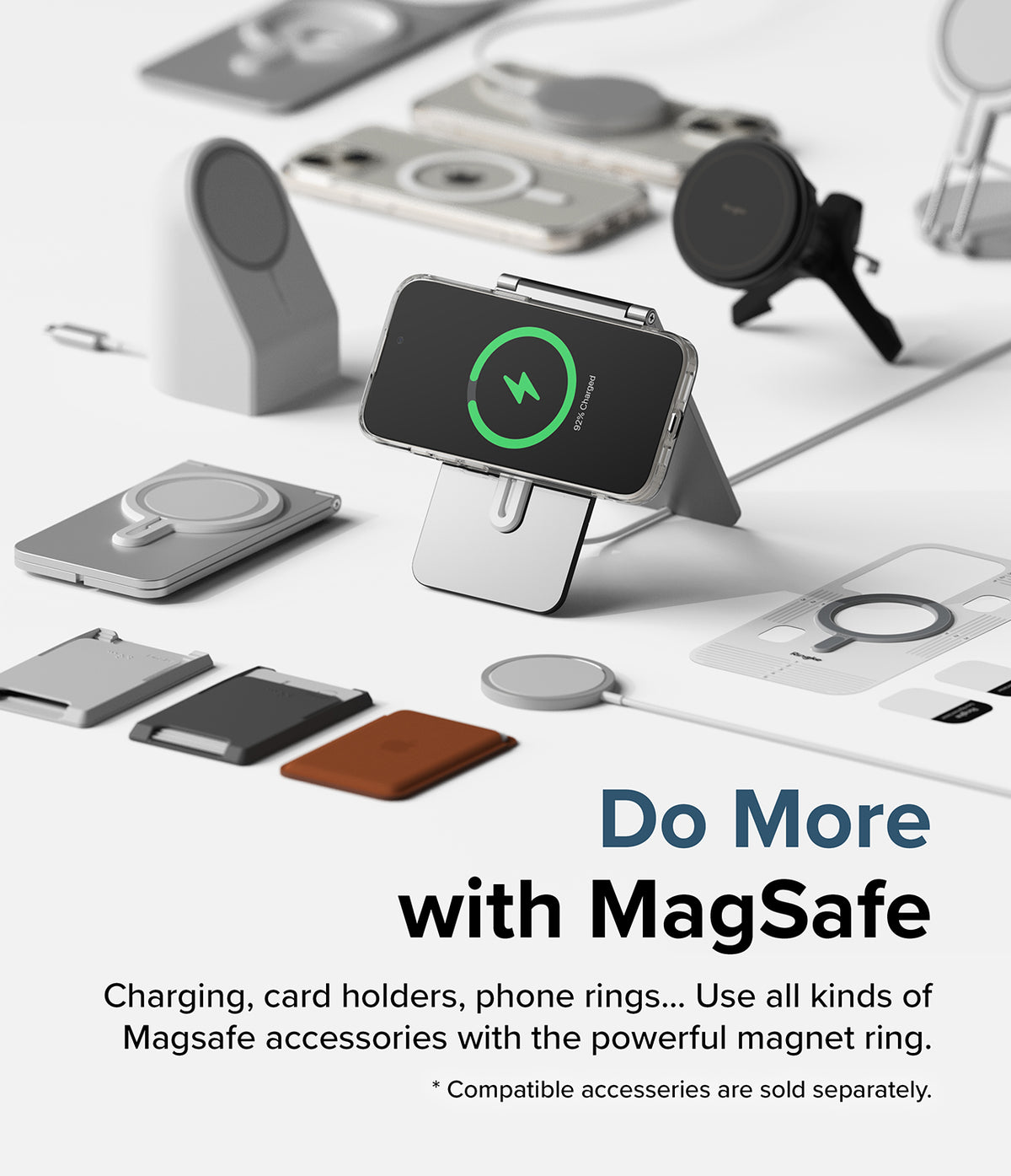 iPhone 15 Case | Fusion Magnetic - iPhone 15 in a clear case charging on a stand surrounded by various MagSafe accessories.