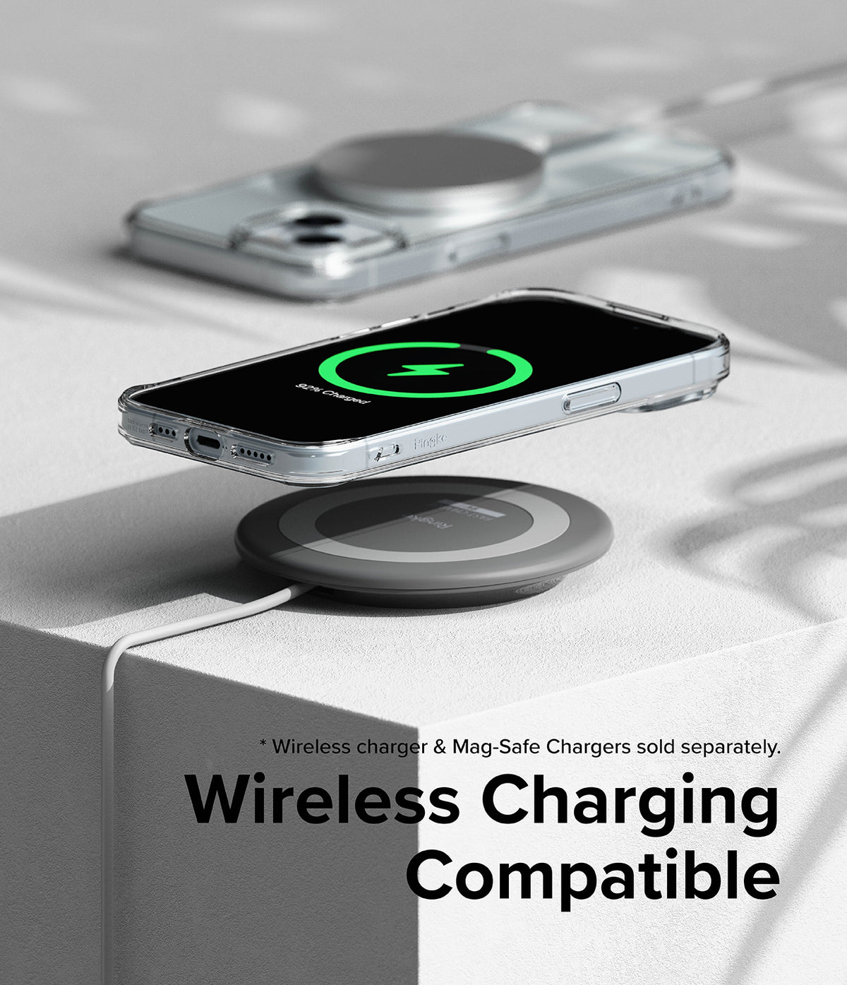 iPhone 15 Case | Fusion Magnetic Matte - iPhone 15 in a clear case hovering over a wireless charging pad.