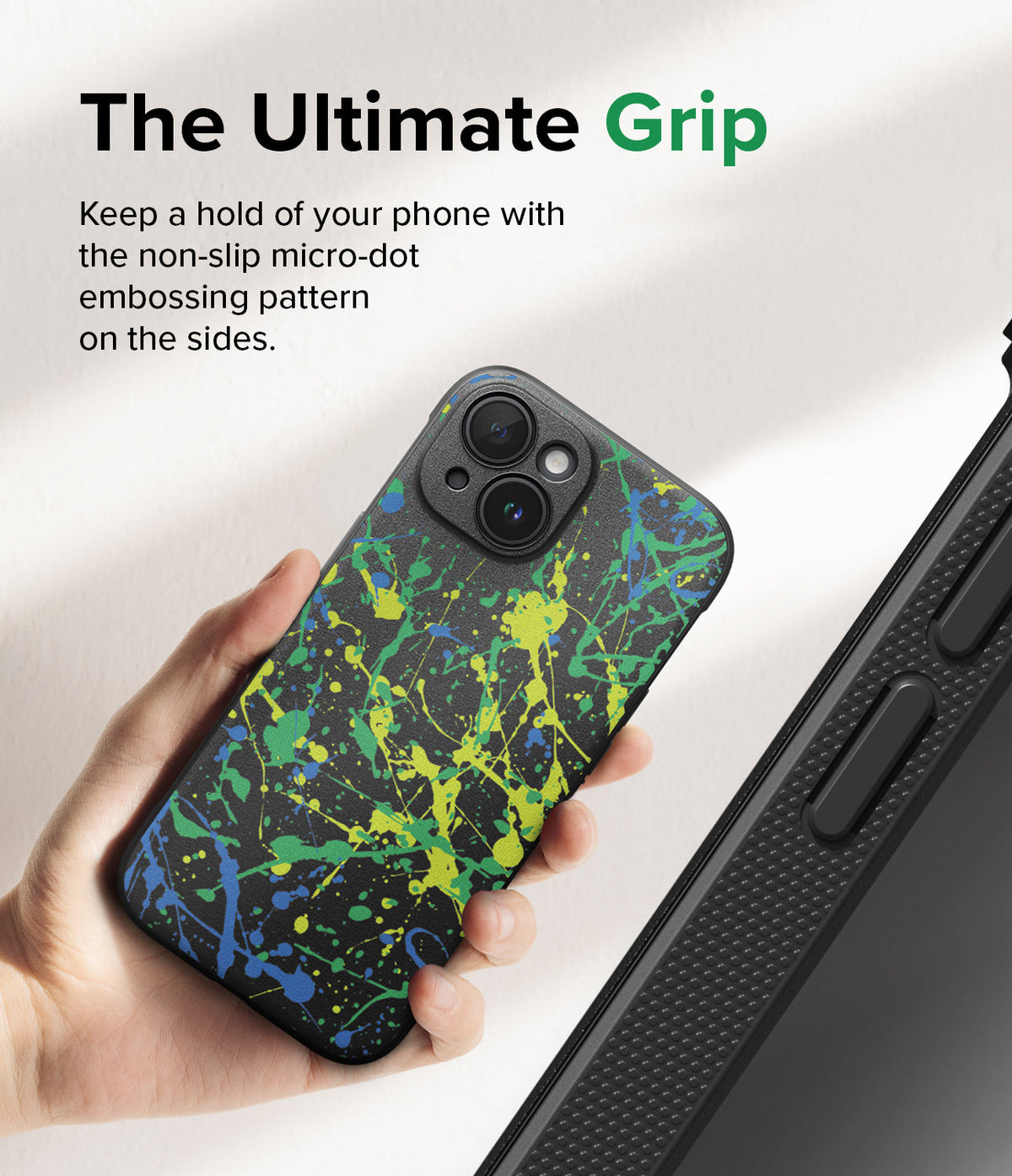 iPhone 15 Case | Onyx Design - Hand holding a black phone case with green and blue paint splatters and micro-dot side grip.