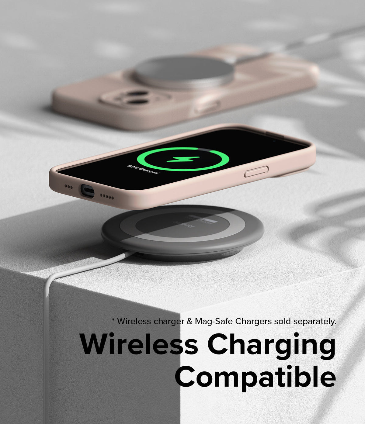 iPhone 15 Case | Silicone Magnetic - Pink iPhone 15 in a silicone case hovering above a wireless charging pad.
