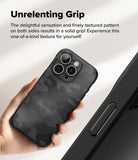 iPhone 16 Pro Case | Onyx - Hand holding a black textured camo iPhone 16 Pro case with a triple-lens camera system.