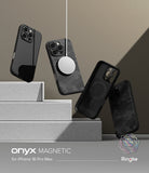 iPhone 16 Pro Max Case | Onyx Magnetic - Four black textured phone cases floating above stone steps with a magnetic charger.