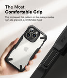 iPhone 16 Pro Case | Fusion-X - Hand holding a clear iPhone 16 Pro case with black textured sides and a dot-patterned grip.