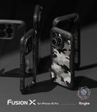 iPhone 16 Pro Case | Fusion-X - Multiple black Fusion-X protective cases with a grey camouflage pattern on a dark background.